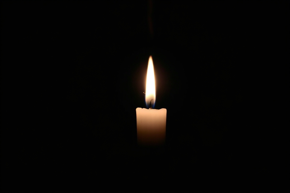 candle flickering in darkness